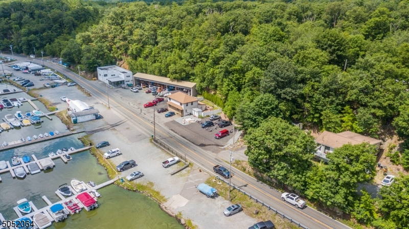 Incredible Investment Opportunity For Any Portfolio! This Property Includes A Full Service Marina With Showroom & Repair Shop, 2 Family Home, Single Family Home, Expansive Outdoor Storage Area & More! This Marina Offers 227 Docks To Provide For Amazing Income Potential, Large Upper Lot For Boat & Trailer Storage Plus A Separate Garage & 3 Potential Residential Incomes! Located On Greenwood Lake's West Shore Near The NJ/NY State Line With Ample Parking, Customer Restrooms, Easy Access To Main Roadways & So Much More, This One Simply Cannot Be Missed!