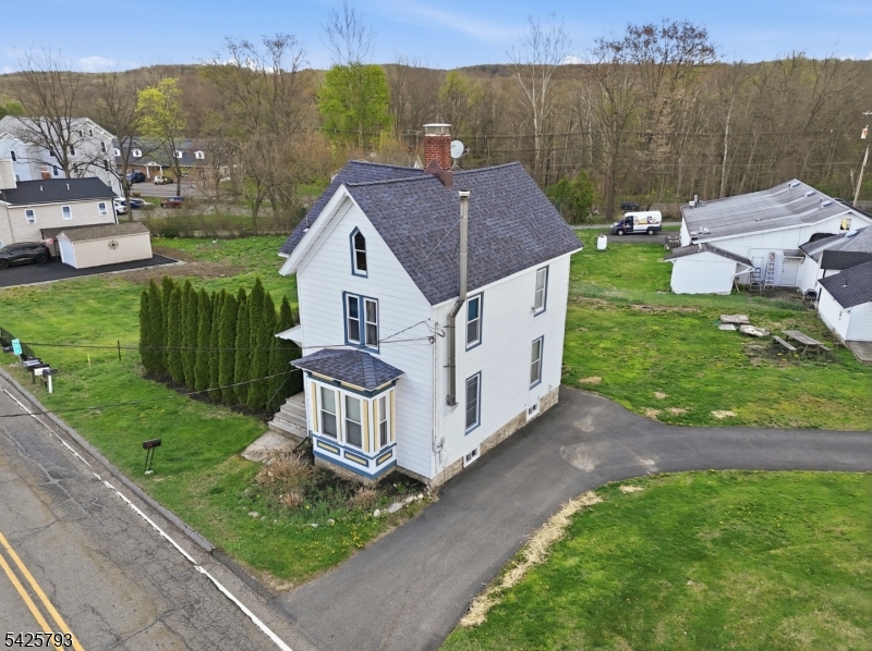PRICE IMPROVEMENT Timeless Charm, Modern Updates & Exceptional Value in the Heart of Andover Borough! Step into a piece of history with all the comforts of today in this beautifully restored 3-bedroom, 2-bath home located in desirable Andover Borough. Originally built in 1877 and thoughtfully restored in 2003, this one-of-a-kind home seamlessly blends historic character with modern convenience. From the moment you enter, you'll appreciate the stunning original banister, hardwood floors, and timeless details that showcase the home's craftsmanship and charm. New carpeting in the hallway and living room adds fresh comfort, while the wood-burning stove creates a cozy atmosphere and provides supplemental heating efficiency. Major updates provide peace of mind, including a new water heater (2025), exterior repainting (2023) new refrigerator, stove, and dryer (2023) new driveway (2022) boiler (2018) septic system (2014) and updated kitchen and bath faucets, including a three-way kitchen faucet. Situated on nearly half an acre, this property offers privacy, space, and functionality with a detached 2-car garage, dual-entrance driveway, and parking for up to 6 vehicles. Enjoy the charm of small-town living while owning a home rich in history, character, and updates already completed for you. If you've been searching for a home with personality, modern improvements, and timeless appeal, this Andover Borough gem is one you won't want to miss.