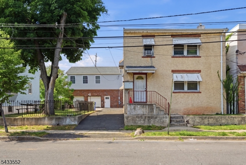Exceptionally rare multi-property opportunity in Linden. Situated on an oversized lot, this unique property features three separate dwellings, making it ideal for investors or owner occupants. The front building is a two-family home consisting of a 2-bedroom, 1-bath unit and a 3-bedroom, 1-bath unit. Separate from the main structure is a newer construction split-level single-family residence offering 4 bedrooms, 2.5 baths, and an attached 2-car garage, providing the perfect private living space away from tenants. All three dwellings will be delivered vacant, allowing the next Owner immediate flexibility for occupancy or rental income potential. The expansive lot offers endless possibilities along with parking for 10+ vehicles. Conveniently located near shopping centers, public transportation, train access, and major highways with an easy commute to New York City, this is a rare opportunity for anyone looking to generate income while enjoying the comfort and privacy of a separate residence.