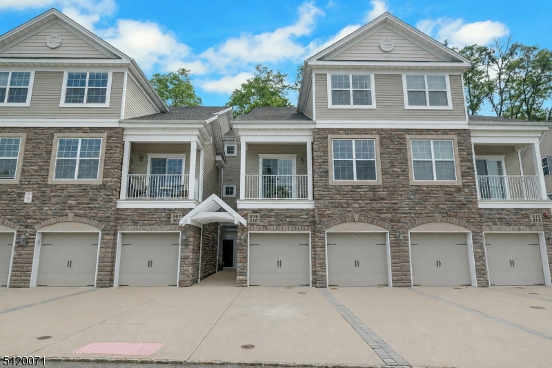 Imagine living just blocks from shopping, restaurants, gyms, parks, scenic trails, and the NYC Midtown Direct train line. This exceptional three-bedroom townhouse offers all of that and more, set against the peaceful backdrop of a tranquil pond. The sought-after Hampton model features a spacious open-concept layout, perfect for modern living. The living room flows seamlessly into the dining area and kitchen, creating an ideal space for both everyday living and entertaining. Step out onto the private balcony off the living room and unwind with a beverage while enjoying stunning sunset views over the water. The beautifully appointed kitchen will delight any home chef, boasting granite countertops, stainless steel appliances, and abundant cabinet space. Gather with friends in the dining area to enjoy meals and make lasting memories. Upstairs, the primary suite serves as a relaxing retreat, complete with its own private balcony overlooking the treetops, a large walk-in closet, and a full en-suite bathroom. Two additional generously sized bedrooms, a full hall bath, a utility/storage room, and a convenient laundry room with attic access complete the second floor. Parking is a breeze with a one-car garage and driveway space for two additional vehicles. Don't miss this opportunity to make your dream home a reality!