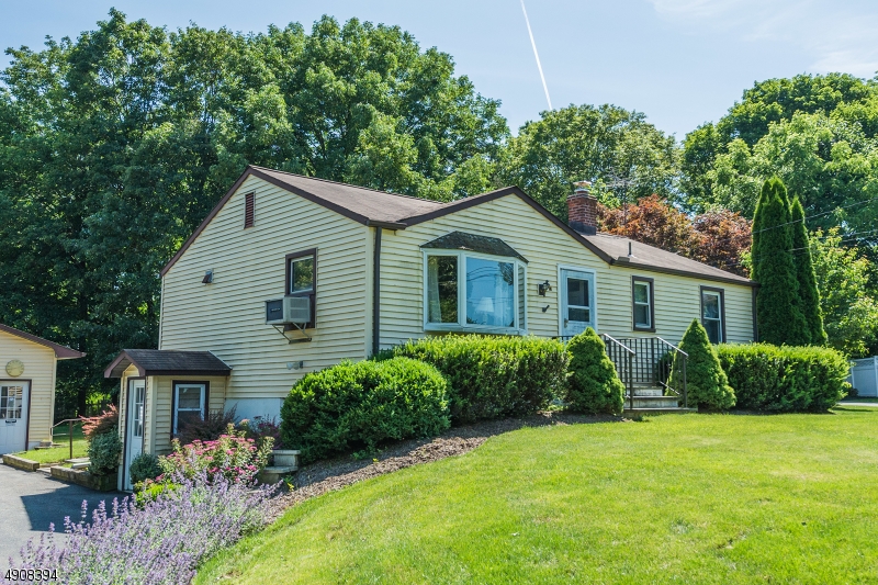 Endless possibilities!  2 bedroom ranch offers hardwood floors, HUGE kitchen, gorgeous lot, 4 car detached garage w/ electric, natural gas, public water, large deck, walk-out basement, all appliances are included.  Walk to town - dining, shopping and parks.  1 minute to Routes 206 and 24.