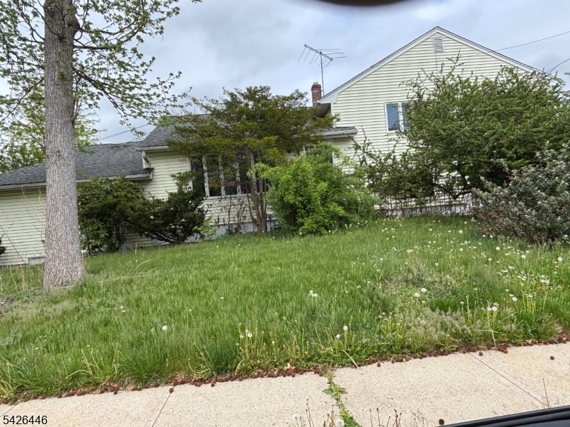 Large mixed use residential/office on corner of Brant with 2 entrances, 2 addresses (48 Brant) and parking areas. On one side a home with a 2 car wide driveway and around the corner a commercial entrance to multiple office spaces with off street parking. Buyer responsible to confirm intended use or uses with municipality.