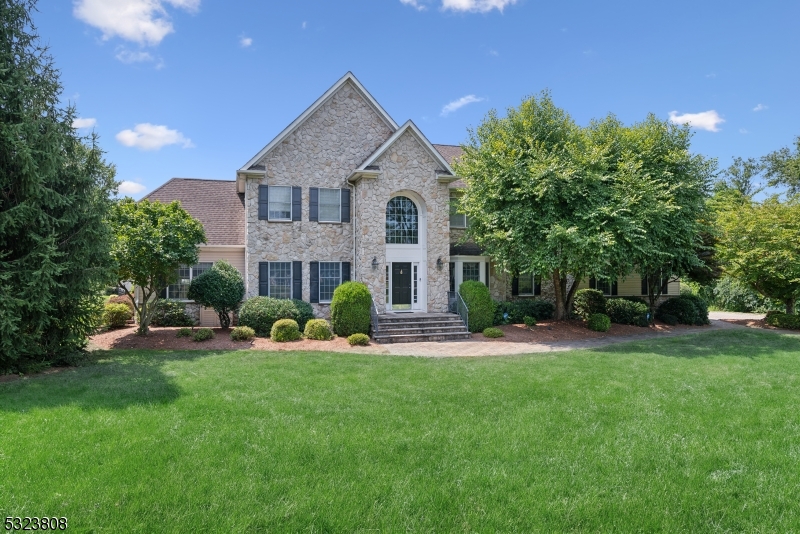 Spacious Sophistication & Tranquil Privacy. Gorgeous Colonial on over 2 acres set mid-block in a bucolic residential cul-de-sac neighborhood, yet close to shopping, dining, highways and more in downtown Chester. Inviting 2-story foyer ushers you into the main level highlighted by gleaming hardwood floors, crown molding and an elegant atmosphere. A cozy living room leads to a sunroom currently used as a movie/entertaining room with vaulted ceilings, built-in bar, and walls of windows. Formal dining room with bay window and tray ceiling can easily host everyone for dinner, and the gourmet kitchen is appointed with stainless appliances, center island and breakfast nook. Next is a stunning family room with vaulted ceiling and stately stone fireplace for chilly evenings, and a dedicated office is down the hall. A large laundry/mud room with garage access and a powder room complete this level. Upstairs, an oversized primary retreat has a huge bedroom, 2 walk-in closets and en-suite with jetted corner tub and separate shower. There's also a junior en suite, plus 2 more bedrooms sharing a Jack-n-Jill bath. Finished lower level offers a sprawling recreation room plus a second powder room and ample storage. An outdoor paradise awaits your summer BBQs with a generous deck with  a retractable awning, and paver patio, sparkling, fully fenced in-ground heated pool with pool house with new roof and electric, and a lush tree-lined backyard with endless space for gardening, relaxing and more.