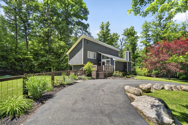 Fully renovated from top to bottom, this stunning contemporary home is tucked away on a quiet cul-de-sac in desirable Byram Township. Set on a beautifully landscaped lot backing to Lubbers Run, a trout-stocked stream, the property offers privacy, character, and modern updates throughout.Inside, soaring vaulted ceilings, skylights, and oversized windows fill the home with natural light. The updated kitchen features shaker cabinetry, stainless steel appliances, updated countertops, and modern finishes. Renovated double-sink bathrooms, bedrooms, flooring, lighting, trim, fixtures, and fresh paint create a truly move-in-ready experience. The dramatic living room showcases a wood-burning fireplace, and direct access to expansive multi-level decks, creating seamless indoor-outdoor living. A finished lower level provides flexible space for a home office, gym, or playroom.Outside, enjoy multiple outdoor entertaining areas, a spacious horseshoe driveway, and a second private driveway leading to the detached garage, providing exceptional parking and convenience.Major improvements include a new roof installed in 2023, a five-zone mini-split heating and cooling system installed in 2022, and a new water heater. Conveniently located near the future NJ Transit Andover Station, which is expected to restore rail service to Sussex County. A rare opportunity to own a fully renovated, move-in-ready home combining contemporary design, beautiful outdoor spaces, and a peaceful cul-de-sac location.