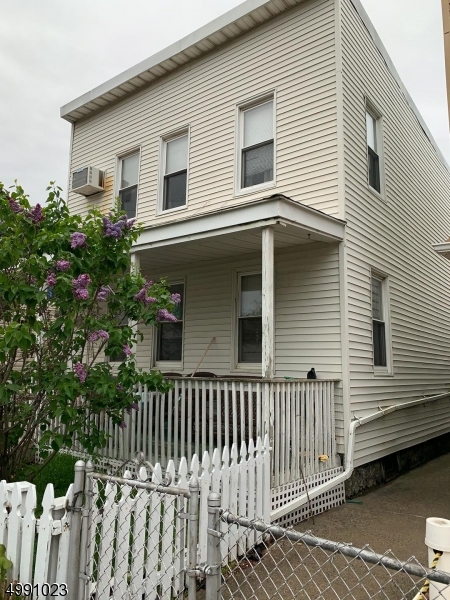 Property is NOT VACANT please do not disturb tenants 3 unit property in Kearny!! Front of property is a 2 family top and bottom units additional unit in rear.  Great investment opportunity, property requires extensive repairs.  Bring your contractor.