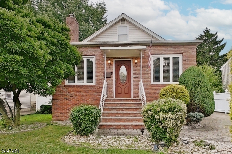 Welcome to 57 Furber St, a beautiful brick-front Cape in Linden, offering character, comfort and an impressive amount of living space. The 1st fl features 2 spacious Bed, a full Bath, gleaming hardwood floors and a gracious entry foyer that opens into a large living room with a warm and inviting wood-burning fireplace. The formal dining room flows into a gorgeous kitchen with granite countertops, an L-shaped peninsula with a built-in cooktop and 2 wall-mounted ovens, providing an ideal layout for cooking and entertaining. An elegant spiral staircase leads to the private 2nd fl primary suite, complete with a walk-in closet, additional storage and a luxurious private Bath featuring a jetted tub and a separate oversized stall shower. Direct interior access to the basement adds convenience and even more possibilities. Step outside and discover a completely private backyard, beautifully designed and fully prepared for entertaining, relaxing and becoming the envy of the neighborhood. A large paved driveway provides plenty of off-street parking. Distinctive, welcoming and filled with special details, this is a home you will be proud to call your own. Schedule your private showing today. We will meet you at the front door!