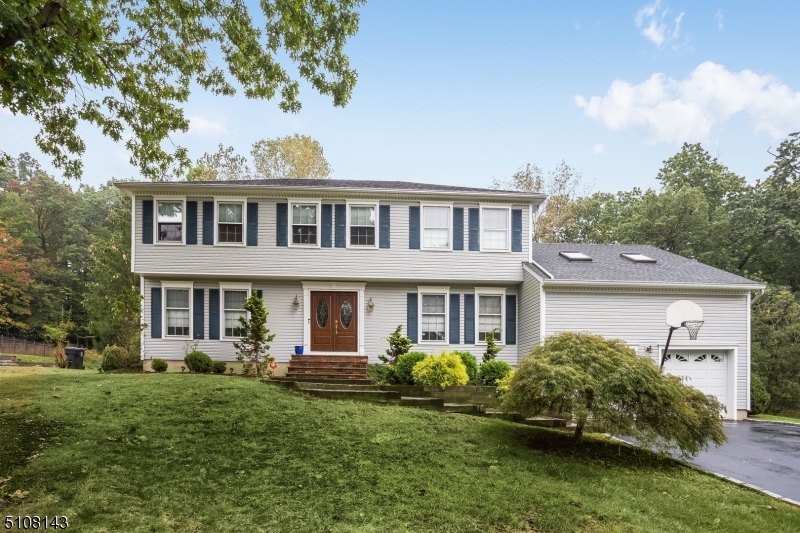 4 bedrooms, 3 bath colonial home in highly desirable Hanover Township know for low taxes & excellent schools. The home features a formal LR, DR to Kitchen boasting s/s appliances. Step outside onto the deck overlooking the back yard with sliders off the kitchen & living room. The family room with windows surrounds the wood burning fireplace. An expansive bonus room over the garage offers room for a playroom, family room or Sunday football games. 1st floor full bath & pantry.  Master bedroom features a walk-in closet and en-suite master bathroom.  3 additional Bedrooms and hall bath upstairs. Partially finished basement with TV area and lots of room. Unfinished area with washer/dryer and area just waiting to be finished. Home backs up to wooded area. Sidewalks and a true neighborhood. Township has a beautiful town pool (additional fee), community center, before/after school programs.  Easy access to the Morris Plains NYC Midtown Direct Train.  Short ride into downtown Morristown with restaurants, shop & theatre. Convenient to major highways