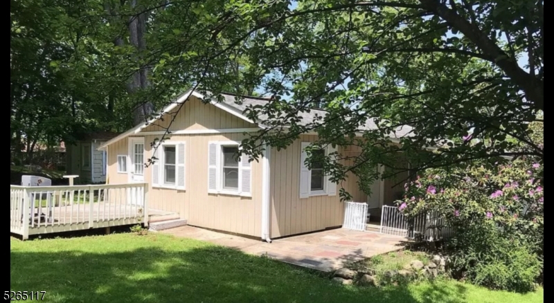 Welcome, to this charming home! Located in this sought after lake community. This cozy ranch is within walking distance to Lk Hopatcong, enjoy boating, fishing, swimming, and hiking. State Park offers boat launch beach with Pavilions campgrounds with grilling.  Yacht Club annual fireworks over lake can be viewed from your own front porch. This home offers a lifestyle plus comfort, renovated with new floors and cathedral ceilings. Once outside you will enjoy a large level yard with plenty storage, along with plenty of parking. Public sewer. Private neighborhood offers tranquility and enjoyment year-round. Location is tucked away yet convenient to all major transportation main highways 80,46,10, and 287. Lots of recreational and entertainment opportunities with this endearing home. Do not miss this one!