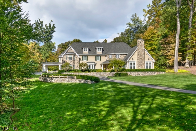 Large, light-filled custom home approached by a tree-lined circular drive on 10 resort-caliber acres with a saline pool, outdoor kitchen, bluestone terracing, bocce court and firepit area. Impressive details and recent improvements lend a fresh, inviting aesthetic to this classic residence featuring five en suite bedrooms upstairs plus an additional in-law suite. Highlights include extensive woodwork, high ceilings, wood and marble floors, window seats, built-ins, designer light fixtures and numerous sets of French doors opening to outdoor living. Premier Far Hills property. NYC is a 12 min. helicopter ride from Morristown or a 60 minute drive.