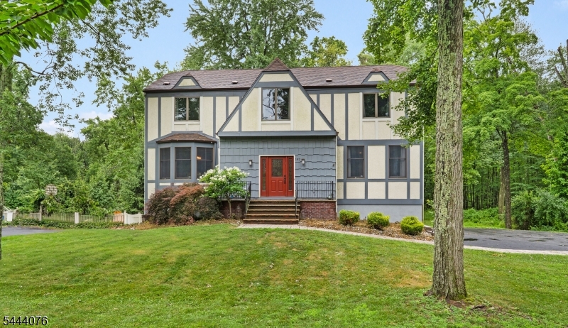 Move right into this center hall colonial! Beautiful 2 NEWLY renovated full bathrooms! 4 Bedrooms plus office on 2nd floor. Large living room, dining room, eat in kitchen and laundry all on the main floor. Very private wooded backyard with charming bridge over the stream. Great location close to schools, pools and 2 miles from downtown Morristown. Hardwood floors throughout. Central air, wood burning fire place, deck, semi finished basement! Come for a visit and fall in love!