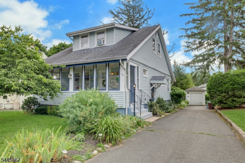 Highest and Best offers are due Tuesday, July 21 at noon. Charming well-maintained colonial situated in a quiet neighborhood just minutes from Ridgewood's schools, vibrant downtown, beautiful parks, and convenient transportation, making it an ideal place to call home. Lovingly maintained by current owner for over 58 years, this beautiful 1,260sf cape-cod colonial style home features: Hardwood flooring, amazing chestnut trim, stain glass window on staircase, open floorplan great for entertaining, sun-filled 3-season front porch, and a 50x125 lot for potential expansion. House/Garage "AS-IS  with no known issues