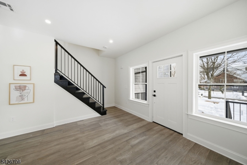 A newly constructed Montclair residence that delivers the clean lines, natural light, and elevated finishes today's buyers expect, without compromise.This 4-bedroom, 4.5-bath home spans four finished levels, offering a layout that feels both expansive and intentional from the moment you walk in.The main level is designed to live effortlessly. The kitchen is sharp and functional with quartz surfaces, stainless steel appliances, and modern cabinetry, opening into a bright living and dining space that feels both elevated and easy.Upstairs, the primary suite feels private and well-proportioned, while additional bedrooms are thoughtfully designed with comfort and usability in mind.What sets this home apart is how much more it gives you.A top-floor retreat offers a flexible, private space that can evolve with you, whether that means work, guests, or simply a place to reset. The lower level adds even more usable living space, giving you room to spread out without sacrificing your main living areas.Every detail supports a turnkey lifestyle, from wide-plank flooring to multi-zone HVAC and all-new systems.This is true new construction in Montclair, offering the rare opportunity to own a home where everything is brand new and designed for how you live today.