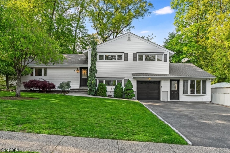 Welcome to Wayne Hills! This unique split level has 3 bedrooms, 2.5 bathrooms, and separate family/bonus room including a kitchenette w/ private outside entrance. The first floor's open layout and large windows provide plenty of natural light with hardwood flooring throughout. Enjoy evenings out on either of the two patios, or cozy up by the stone-adorned wood-burning fireplace in the living room. The new and beautifully renovated open concept kitchen includes a large white oak center island, tons of white cabinetry w/ built-in pantry, quartz countertops, and stainless steel appliances. Steps down to the ground floor lies a large family room w/ sliders to second patio in backyard, garage entrance, laundry room, & half bathroom. On the second floor, you'll find three sizable bedrooms w/ hardwood floors and ample closet space. Second floor also includes two full bathrooms, including a primary en-suite. Additional features include a 1 car attached garage, central heat, & air conditioning. Large fenced in yard. Conveniently located minutes from town's main shopping areas, restaurants, schools, & NYC transportation.