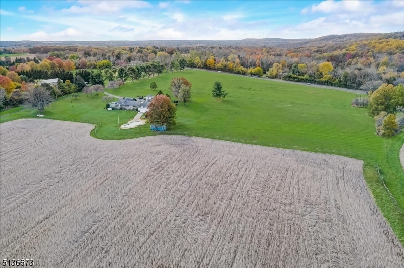 This 130+ acre property has the DEVELOPMENT RIGHTS INTACT and is in the VRC zone in Hopewell Twp. The land being sold consists of two parcels:  Block 62 Lot 3 which includes 95.4 acres, two houses and several outbuildings (offered separately for $2,750,000) and Block 62 Lot 2.02 with 35.17 acres. Both parcels are currently farm qualified, reducing the property taxes. The future Owner of this property could explore developing the land further or selling the development rights of one or both parcels. According to the 2020 Mercer County Master Plan these parcels are targeted for preservation since many of the surrounding properties are preserved and protected by conservation easements. Other possible options for the property one can explore include turning it into an equestrian destination, a vineyard, a possible solar farm or building a house of worship (buyers to independently verify all intended uses of the property with the township). The 3 bedroom, 3 full bath main house is one level and built in the late 1960s/early 1970s. It has an eat in kitchen, dining room, living room, family room, vaulted ceilings, beautiful views of the surrounding land, generator, 3 car garage and inground pool. The farmhouse has 3 bedrooms, 2 full bathrooms and outbuildings including a three bay garage and six stall barn. The property is near major routes including 295 & Rt. 31. Buyer responsible for the rollback taxes if the farm qualification is not maintained.