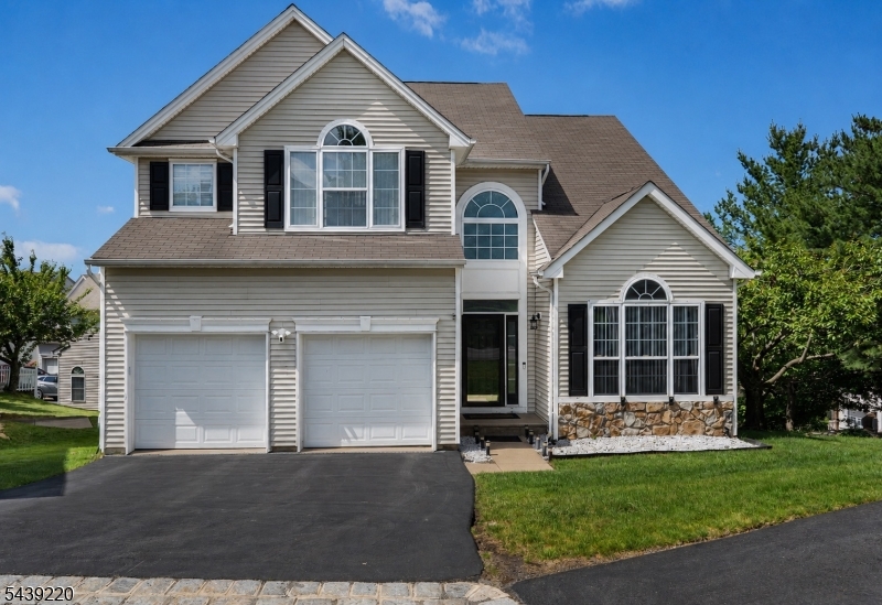 Nestled on a quiet cul-de-sac in the highly sought-after Woodfield Estates community of Mt. Olive, this beautiful Deerwood Model Colonial offers 3 bedrooms, a spacious loft w/ potential for a 4th bedroom, and 3.5 baths. A grand two-story foyer welcomes you into the living room w/ soaring cathedral ceilings and a formal dining room, perfect for entertaining. The updated gourmet kitchen features stainless steel appliances, granite countertops, stylish backsplash, pantry, modern lighting, and a large center island, flowing seamlessly into the inviting family room with a cozy gas fireplace. Upstairs, you'll find generously sized bedrooms, including a luxurious primary suite with a vaulted ceiling, walk-in closet, and spa-like bath. A convenient 2nd floor laundry room and expansive loft providing  flexible living space. The walk-out finished basement offers a full bath, office, game room, and exercise room. Recent updates include a 1-year-old A/C unit and 2-year-old hot water heater, an invisible dog fence and a beautiful paver patio perfect for outdoor relaxation. Residents enjoy outstanding community amenities including an outdoor swimming pool, tennis courts, basketball court, ball field, and playground. Located in the highly rated Mount Olive School District and just minutes from shopping, dining, and major highways. A wonderful opportunity to enjoy comfort, convenience, and an exceptional lifestyle.Don't miss this incredible opportunity to make this beautiful home your own!