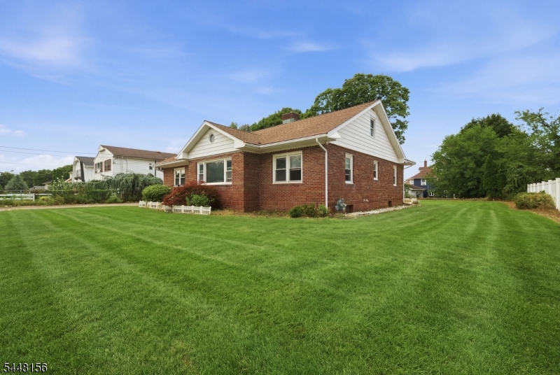 Charming Brick Home on a Large Flat Lot - Ready for Your Vision! Opportunity awaits in this charming 3-bedroom, 2-full-bath ranch situated on a large, flat property with plenty of room to enjoy outdoor living with covered porch right off kitchen.  Featuring a classic brick exterior and great curb appeal, this home offers character, space, and unlimited potential for the right buyer. Inside, you'll find a spacious kitchen with plenty of room for cooking, gathering, and entertaining an ideal space to reimagine and make your own. The functional floor plan includes three generously sized bedrooms, each offering large closets for ample storage and 2 full bathrooms. First floor laundry offers convenience and the walk up attic provides additional room for storage as well as potential for expansion. Its solid layout, charming exterior, and desirable lot size make it a fantastic opportunity for homeowners, investors, or renovators looking to add value. Conveniently located to downtown and major highways.
