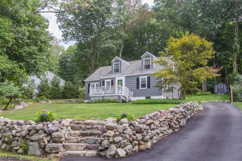 True Pride of ownership in this custom home! Spectacular expanded Cape nestled on Park Like Setting w/tremendous curb appeal. Flowing, practical layout great for entertaining. Updated, eat-in kitchen offers a ton of counter/cabinet space & SS appliances. Sun-filled FR w/french doors & sliders to back deck. Formal living room warmly welcomes you in, boasting a bay window. Two 1st floor bdrms & updated full bath. Upstairs, 2 addtl bdrms w/vaulted ceilings, a full bath & HW floors. Full bonus BSMT- laundry & storage. Beautifully landscaped front & private backyard oasis with patios, decks & wood fence. Perfect for Entertaining & Relaxation! Enjoy the Privacy & peacefulness of rural Boonton Twp. just mins from Denvilles bustling DWTN, NYC-Direct transport & major hwys. Award winning school system. Low taxes.
