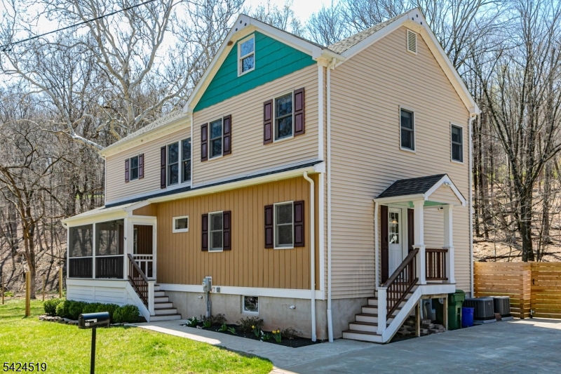 In a serene section of Skillman, where the wooded landscape creates a soothing naturalenvironment to come home to, this custom-built house supports a lifestyle defined by calm,comfort, and thoughtful design. A screened front porch greets you first, inviting long, unhurriedmornings and evenings framed by trees and filtered light. Inside, the home unfolds with a senseof craftsmanship and clarity. The kitchen anchors the main level, conceived as both a functionalworkspace and a social centerpiece. Quartz surfaces wrap the room in a clean, modern finish,while a suite of stainless-steel appliances supports serious cooking. A built-in double oven witha warming tray, microwave, dishwasher, refrigerator, and a five-burner cooktop with pot filler andhood reflect a deliberate attention to detail. Hardwood floors run through the kitchen, living, anddining rooms, providing warmth and continuity. Crown molding adds a tailored architectural note.Each of the three bedrooms is designed as a private suite, complete with its own full bath. Theprimary suite stands apart with a generous custom walk-in closet and a bath that reads like apersonal spa. Two vessel sinks sit atop refined surfaces, complemented by a soaking tub and aseparate shower. Outside, ample parking accommodates visitors with ease. A thoughtfullyplaced shed and an attractive privacy fence create structure without interrupting the organic feelof the setting. The patio and deck extend the living space outdoors.