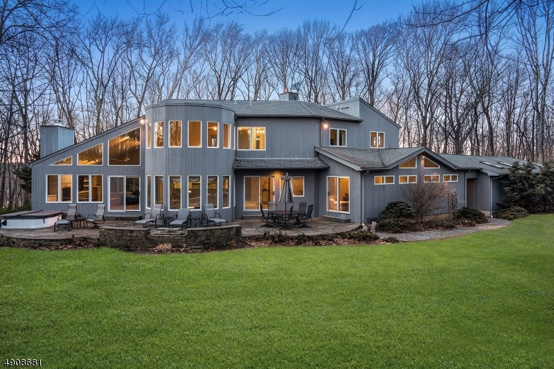 PRIVACY & BEAUTY!!!  Truly exceptional bright and light contemporary home with open layout and lots of huge windows on over three acres is awaiting new owners!! Designed by owner/builder with love and attention to details!!  Flexible floor plan!!  First floor features impressive great room with wall of windows, kitchen with breakfast area overlooking beautiful yard, dining room, living room, office, bedroom with full bath, powder room, gym, mud room.  2nd floor will impress you with master bedroom suite w/ updated bath & walk-in closet, 2 other bedrooms & office/bedroom as well as another bath. Full unfinished basement, 3.1 car garage, perfect backyard for entertaining w/flag stone patio & hot tub backing to Farney State Park complete the picture of perfection!!  Too many things to list - come and see!!!