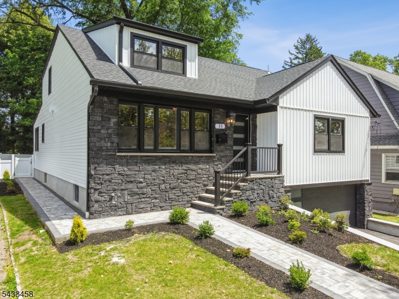 Step into modern elegance at 15 Elberta Road, where every detail has been meticulously reimagined in this fully renovated 5-bedroom, 3.1-bath home.The sleek, contemporary entryway welcomes you into bright, airy interiors. An open-concept layout bathes the living spaces in natural light, creating a warm and inviting atmosphere. The sunlit front living room sets the tone, while the chef's kitchen featuring stylish cabinetry and a spacious island flows seamlessly into the dining room, making it perfect for entertaining. Just behind the kitchen and dining room is a cozy family room. Completing the first floor is a powder room, a mudroom with a laundry hookup and convenient access to the backyard, and two bedrooms including a luxurious primary suite with a private en suite bath. Upstairs, there are three additional bedrooms and a full bath, providing ample space and plenty of storage.The fenced backyard offers privacy and the opportunity to craft your own outdoor oasis. Plus, a finished basement with its own full bath adds even more functionality. Near Borden Park, the Maplewood community pool, and a jitney stop with service to NYC direct trains.