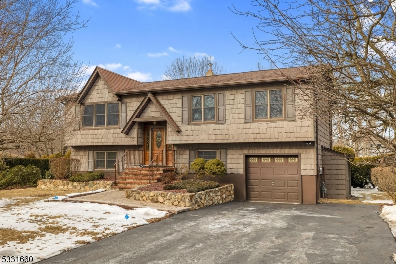 Impeccably maintained bilevel in West Brookwood, with BRAND NEW SEPTIC SYSTEM, only needs personalization to make it your perfect home!  Features include hardwood flooring under wall to wall carpeting throughout the upper level, eat-in kitchen with stainless steel appliances, full bath with granite counter top and tub/shower, 3 large bedrooms, custom moldings and pull down stairs to attic, fully floored for storage. Lower level with family room, office and laundry room with washer and dryer included, sliders to patio and level, usable backyard with storage shed.  Deck, spacious enough for entertaining, features retractable awning.  Other highlights include natural gas heating, thermal windows, 1 car attached garage, central air, public water, paver walkways, new steps and porch.  Fantastic neighborhood and minutes to Rts. 80, 46, 10 and 206, shopping, dining, NJ Transit Train and more!  Furniture and lawn equipment to remain; all items in house to remain, sold as-is with contents.