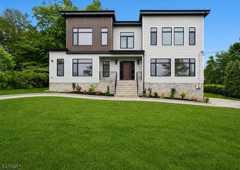 Experience the pinnacle of Contemporary Living in this stunning, 6,995 sq ft brand New Construction ideally located on .50 acre on a quiet street in highly rated Deerfield Elementary School district! Sleek modern architecture meets unmatched beauty & quality! This expansive residence features an open concept layout with grand 2-story entrance hall, soaring 10' high ceilings, rooms of enormous proportions, and a gourmet eat-in kitchen with high end appliances, center island, totally open to incredible 2-story Family room with 6' linear gas fireplace. Sliding glass doors give easy access to expansive patio & beautiful sodded, totally fenced property. There is plenty of room for a pool! Inviting Guest Bedroom Suite conveniently located on the 1st level. On the 2nd level, there is a luxurious primary suite with custom closet, spa-like bath plus 3 more en suite bedrooms & convenient laundry room. Beautifully finished lower level with recreation room, full bath, and access to 3-car attached garage. This spectacular home is just 0.8 miles from highly rated Deerfield Elementary School. Bus service is provided to world class schools including Washington School (5th grade), Millburn Middle & High School! This home is also 2.2 miles from the Turtle Back Zoo and Codey Arena, 2.3 miles from Gero Park, the town's recreation center with baseball fields, tennis & pickleball courts, the town pool & par 3 golf course, and just an 18 minute drive (12.2 miles) to Newark International Airport!