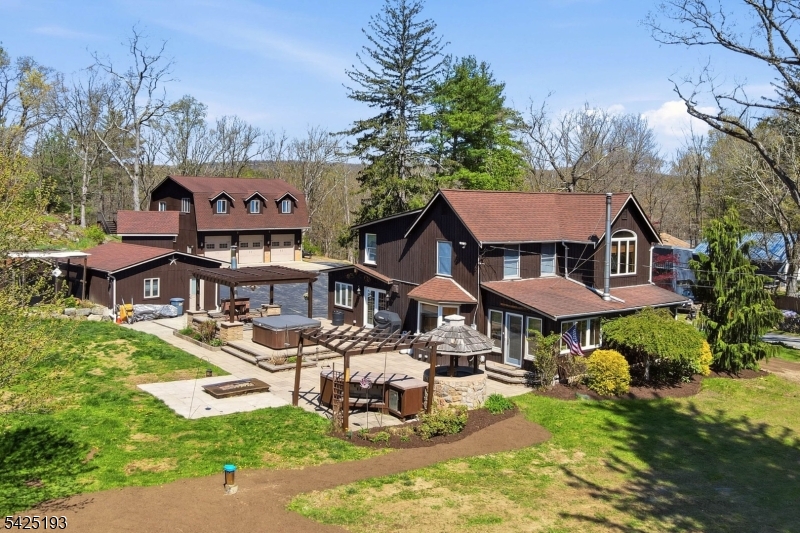One-Of-A-Kind Craftsmanship With Everyday Function In This Thoughtfully Designed Property. The Custom Eat-In Kitchen Features A Breakfast Bar, Beamed Ceilings, Remote Skylights, Granite Countertops, Radiant Heat Beneath Penn Dutch Hardwood Floors, Commercial-Grade Dacor And KitchenAid Appliances, Bronze Cast Farmhouse Sink, Prep Sink, Electric Fireplace, And Built-In Desk. The Home Offers All-New Lighting, Beautifully Renovated 2025 Bathrooms, A New 500+ Ft Drilled Well With The Original Well That Can Be Used For Irrigation, New Water Softener And Well Tank, On-Demand 240 Gallon Hot Water Tank, Central Vac, Surround Sound, And Pocket Doors Leading To A Sunroom With Wood-Burning Stove And Walkout To The Patio With Outdoor Fireplace And Fire Pit. The Second Floor Includes 3 Bedrooms And 2 Full Baths, Including A Primary Suite With Private Full Bath And Walk-In Closet. Exterior Highlights Include A Large Paver Patio, Kohler Whole-House Generator, Detached 24'x22' Ice House With Upper/Lower Storage And 50-Amp Service, Plus A 35'x42' (1,470 Sq Ft) Oversized 3-Bay Garage With 200-Amp Panel,  And Car Lift Ready. Additional Features Include 50-Amp RV Service And 2-Car Garage With 50-Amp Electric. Ideal For Car Enthusiasts, Hobbies, Or Entertaining Year-Round. Close To Route 23 And Just 1 Hour To NYC! So Much To See And Opportunities Like This Are Few And Far Between!