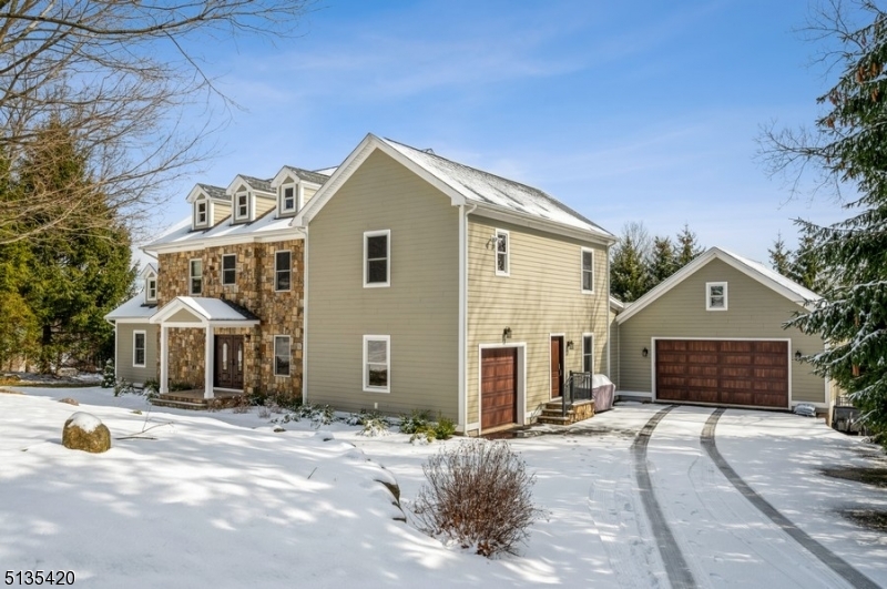 Stunning & unique custom colonial boasting 4 BD, 3 full BTH and 1-half BTH on over 1 1/2 acres meticulously manicured property in Mt Olive Twp. Built in 2013 on a highly desirable tranquil cul-de-sac. This home includes a 2-car garage plus a separate 1-car garage, 3 fireplaces, 3 large patios w/great privacy and a sparkling resort style in-ground gas-heated swimming pool with a large custom patio & firepit. The comfortable open layout w/harmonious flow is ideal for entertaining w/rich hardwood floors, recessed lighting and an abundance of natural light w/large windows throughout. The foyer opens to an elegant den w/glass doors, a formal DR and a large office. The spectacular open kitchen is elegantly appointed w/granite counters, high-end appliances, a center island and a coffee bar. The flow continues to a breakfast area and a gorgeous living room w/a dramatic vaulted ceiling, a gas fireplace set in a natural stone accent wall and a wet bar. This level also includes a 1/2 BTH, access to garage, mudroom and walkout to a large rear covered roof patio overlooking the pool. The 2nd floor includes a spacious primary bedroom suite w/fireplace, a huge walk-in closet and luxurious en suite BTH. 2 add'l BD share another luxurious Jack-and-Jill bathroom, along w/an upstairs laundry room. The full finished basement level offers a 4th BD w/a walk-in closet, 2 bonus rooms, plenty of storage and FR w/fireplace and double sliding glass doors opening the fabulous outdoor patio & backyard.
