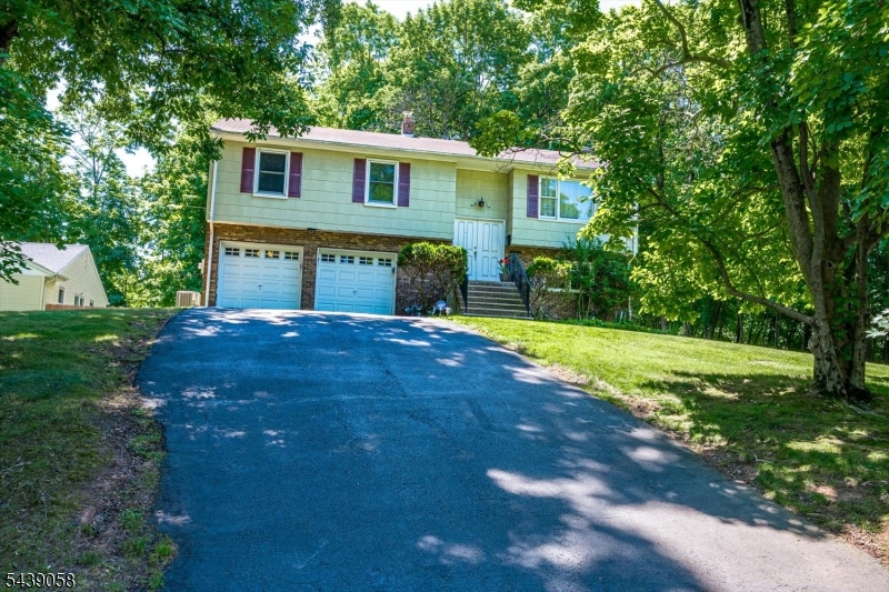 Welcome to this beautifully maintained 4-bedroom, 2-bath bi-level home in the highly sought-after Netherwood Heights section of Plainfield. Situated on a prominent corner lot just under one-half acre, this property offers the perfect blend of modern updates, spacious living, and exceptional outdoor space. The heart of the home is the remodeled kitchen, featuring updated cabinetry, countertops, and appliances designed to meet the needs of today's lifestyle. Both full bathrooms have also been tastefully renovated, providing contemporary finishes and comfort. Sun-filled living and dining areas create an inviting atmosphere for everyday living and entertaining, while four generously sized bedrooms offer flexibility for guests, or home office needs. The lower level expands the living space with a versatile family room, recreation area, or work-from-home setup. Built-in two-car garage provides convenient parking, additional storage, and direct access to the home. Large windows throughout fill the interior with natural light and showcase the property's attractive surroundings. Outside, the expansive corner lot offers endless possibilities for outdoor entertaining, gardening, recreation, or future enhancements. Conveniently located near the Netherwood train station, major highways, parks, shopping, and dining, this home combines suburban charm with commuter-friendly access. A rare opportunity to own a move-in-ready home in one of Plainfield's most established neighborhoods.