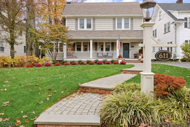 Expansive Westfield Colonial with 5 bedrooms and 5.1 bathrooms on manicured lot, less than a mile to the train station, shops, eateries, schools, and parks. Distinctive features include gorgeous hardwood floors, crown molding and coffered ceilings, 3 fireplaces, and beautifully scaled rooms designed for comfortable living and entertaining. Beyond the welcoming front porch, the interior flows from the foyer to the living room with an elegant fireplace flanked by built-in display shelving and cabinets. The dining room is spacious enough for hosting a crowd, and adjacent butler's pantry is perfect for  serving cocktails and keeping you organized. The sparkling white kitchen is equipped with high-end appliances, an oversized island, and separate breakfast nook with sliding glass doors to the patio and back yard. A powder room,  office, and a large family room with a wall of windows finish the floor. Upstairs is the primary bedroom  complete with a furnished walk-in closet and a lavish private bathroom. There are 3 additional bedrooms, one with an en suite bathroom, a 2nd laundry area, and a full bathroom in the hallway. A large bedroom and full bath on the 3rd floor.The finished basement offers a large recreation room with wet bar, a game room, full bathroom, laundry room, and ample storage space.To top it all off, the beautifully landscaped back yard includes a sprawling patio with an outdoor kitchen, an outdoor fireplace, and plenty of privacy.