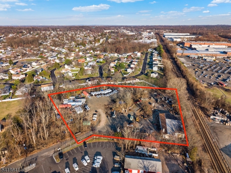Approximately 4 acres currently a pre existing non conforming grandfathered construction company office & warehouse. Zoned R10 residential.