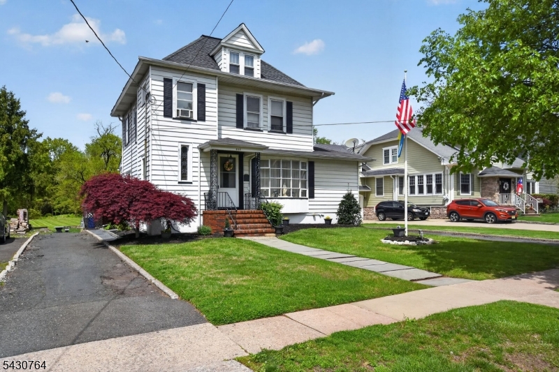 Beautiful Colonial located on a quiet tree-lined street offering timeless charm and generous living space. Features 4 bedrooms on the second floor with a flexible 5th bedroom option in the attic, original hardwood floors throughout, 3-zone heating, and a partially finished basement. First floor includes a spacious living room, formal dining room with decorative fireplace, eat-in kitchen with newer stove and dishwasher, full bath, and mudroom. Exterior highlights include a full deck, LP generator, horseshoe driveway, detached 3-car garage, and an impressive 450-ft deep backyard. Conveniently located near the Rahway Train Station, major highways, restaurants, and the Union County Performing Arts Center. Property is located in a flood zone; flood insurance required.  Fireplace, flue, and chimney are sold as-is.
