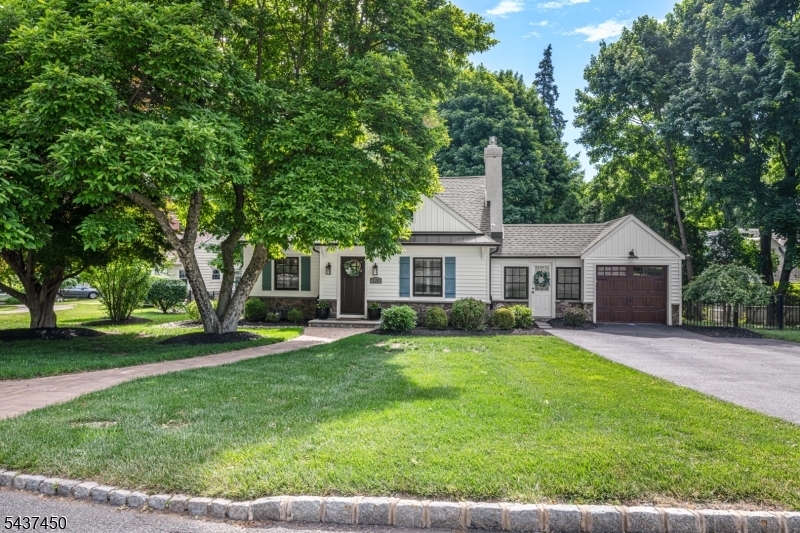 Welcome to this beautifully updated, move-in-ready expanded Cape offering 4 bedrooms and 2 full baths. An oversized mudroom with custom built-ins provides a warm welcome and opens to a private backyard patio, perfect for relaxing or entertaining. Inside, you'll find hardwood floors, crown molding, wainscoting, raised-panel details, and recessed lighting throughout. The spacious eat-in kitchen is a standout, featuring quartz countertops, a subway tile backsplash, and classic white shaker cabinetry. Chic and comfortable living room boasts oversized gas fireplace. The versatile floor plan includes two nicely sized bedrooms and a full bath on the first floor, with two additional bedrooms and a second full bath upstairs. A bonus room off the attached garage offers the ideal space for a home office, playroom, or gym. The newly finished basement adds valuable living space along with abundant storage. Major updates include newer roof, siding, windows, interior and exterior doors, HVAC and septic system. Ideally located just minutes from shopping, dining, major highways, train, and bus transportation, this turnkey home combines comfort, style, and convenience. Unpack and enjoy everything this exceptional property has to offer.