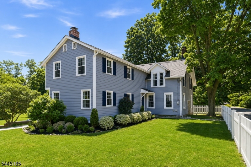 WOW! This completely renovated Colonial is sure to impress! The stunning gourmet kitchen features white quartz countertops, a custom refrigerator, a 6-burner Thermador range, double ovens, and two dishwashers. The beautifully tiled dining area offers radiant heated floors and sliding doors leading to a newer deck overlooking a beautiful yard. The first floor also features a spacious living room with newer pine hardwood floors, and a warm, inviting family room and den with a fireplace. Upstairs, the primary suite includes a beautifully renovated private bath, along with three additional generously sized bedrooms and the convenience of a second-floor laundry room. Step outside to a spacious, private backyard featuring a patio, newer deck, walkways, fencing, and a newly paved driveway. A detached 3-car garage with a finished loft and private gym offers incredible flexibility. Approximately 1000 Sqft. Loft above garage. Whether you're a contractor, carpenter, electrician, or simply need extra space, the finished loft is perfect for a workshop, home office, or hobby room. Major updates completed in 2018 include new windows, roof, electrical, plumbing, and a hot water heater. Absolutely nothing to do but move right in!