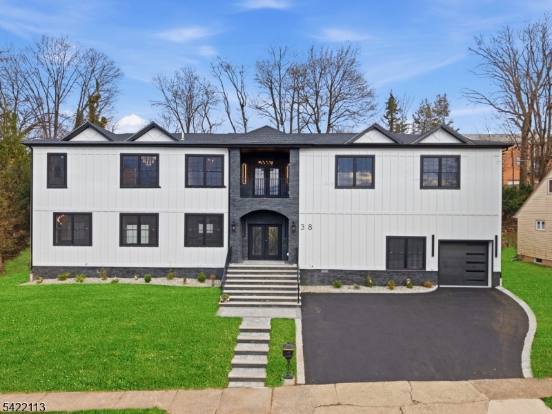 Welcome to a truly spectacular brand-new construction built on an existing foundation, where bold design meets uncompromising luxury. This one-of-a-kind residence offers 4 bedrooms and 6 bathrooms, featuring three lavish primary suites including a stunning first-floor suite and two grand retreats upstairs each designed for ultimate comfort and privacy.From the moment you enter, you're greeted by a breathtaking open-concept layout flooded with natural light, anchored by a show-stopping designer kitchen that flows effortlessly into expansive living and dining spaces perfect for elevated entertaining and refined everyday living.The fully finished basement delivers an entirely new level of versatility, ideal for a private gym, media lounge, or entertainment retreat.Step outside to enjoy a fully fenced yard, offering privacy and space for outdoor enjoyment, complemented by the convenience of an attached garage.Every inch of this home has been meticulously curated with high-end finishes, sleek modern design, and statement details throughout, creating an atmosphere that is both sophisticated and unforgettable.This is not just a home it's a standout luxury statement, offering the rare opportunity to own essentially new construction with extraordinary space, design, and presence.