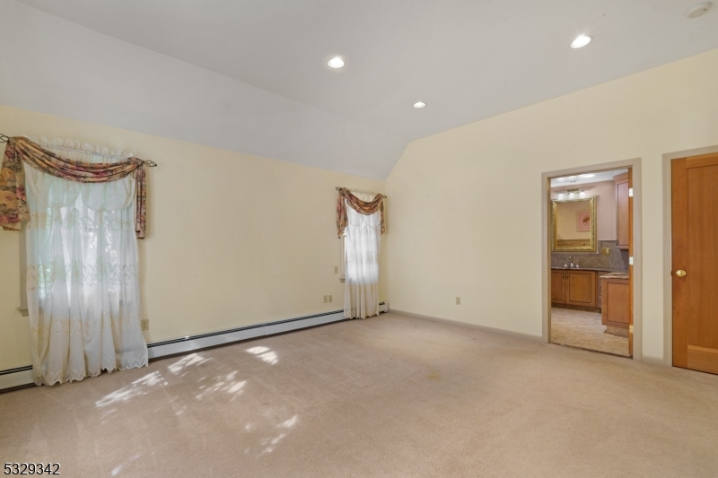WONDERFUL CUSTOM HOME SITUATED ON A  7.68 ACRE TREE FARM IN THE MIDDLE OF LONG VALLEY.  IT'S CURRENT USE IS A LANDSCAPING/ NURSERY/ TREE FARM, OR THIS LEVEL LOT WOULD BE GREAT FOR HORSES.  Buyer to do their due diligence with the township.  This custom home features a 20' x 20' gourmet kitchen with 8' island and s/s appliances.  The 22' x 14' dining room can fit all of your guests. The family room boast a cozy stone fireplace. The primary bedroom and primary bath are on the 1st floor.   Second floor consists of two more bedrooms and main bath. The full finished walkout lower level adds an abundance of additional space.   There is a two car garage as well as a  52' x 38' out building with electric.  Property is supplied by natural gas.  Public water is at the street.  This is a must see property !   Includes access to the highly rated Long Valley school system.