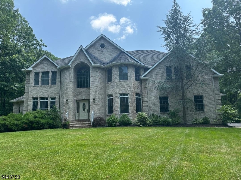 Welcome to this stunning custom built, 5100+ sq. ft beauty set on 7 lush, private acres backing to Allamuchy State Park. Nothing was spared in this elegant home which offers a gracious 2 story entryway, 5 spacious bedrooms, 4.5 baths, a well-planned gourmet kitchen with hardwood floors, high end appliances, granite counters, breakfast area that looks out on to a tree lined private rear yard, large formal living room and dining room, first floor office, spacious family room with wood burning fireplace, massive second floor media room with outdoor balcony, 3 car heated oversized garage, full finished basement and the list goes on! Centrally located in close proximity to shopping, dining and commuting, this fine home is a must see for the discriminating buyer.