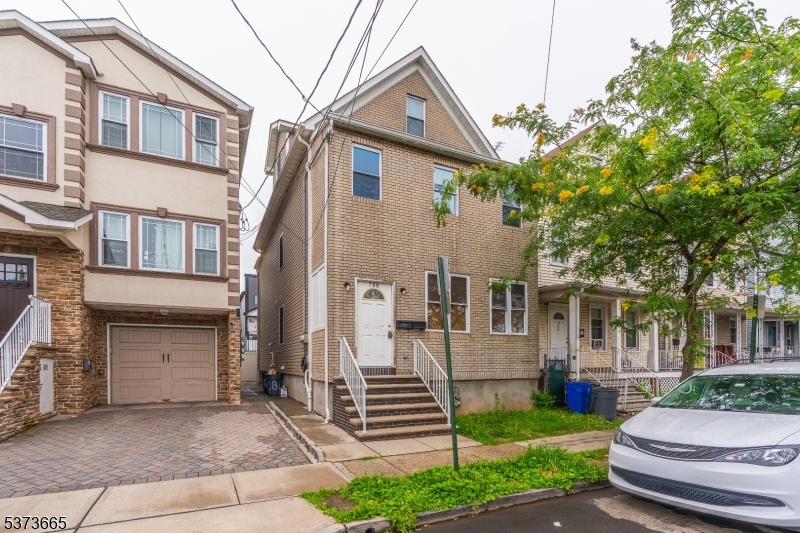 Welcome to this beautifully renovated two-family home, complete with a finished attic and basement! Each unit features updated kitchens and modern bathrooms, as well as central heating and air conditioning for year-round comfort. Whether you're an investor seeking strong rental potential or an owner-occupant looking for additional income, this property is an excellent opportunity. Ideally located just minutes from shopping centers, major highways, NYC, and public transportation this home offers both convenience and value.