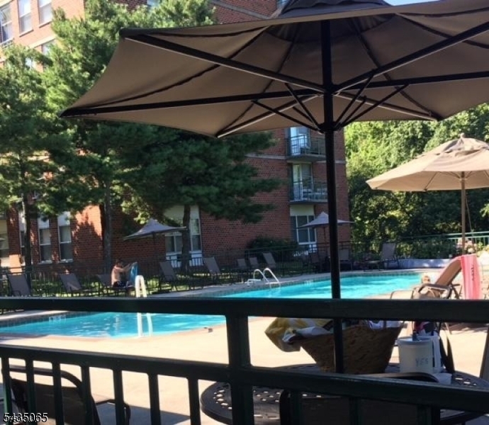 Two bedrooms and Two baths in this bright and sunny unit at The Mill at Little Falls within walking distance to the Train station, NJ Transit Bus stop across the street plus walk to restaurants and town center. Hardwood floors, Fireplace in Living room with oversized windows, large walk-in closet, Washer Dryer in unit, one reserved covered parking space included. Beautiful grounds to explore with water fall to enjoy from common patio area plus amenities such as Gym, pool, tennis, community room and walking and jogging paths,