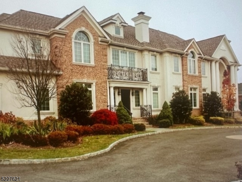 LOCATION, ,LOCATION ! PRESTIGIOUS  "BEL AIR WOODS" LUXURY CUSTOM HOME APPROX 9,000 SQ FT OF LIVING SPACE, SURROUNDED BY MULTI-MILLION $ HOMES.. YOU ENTER MARBLE GRAND FOYER WITH CUSTOM IRON RAILINGS TO A DOUBLE STORY GREAT ROOM WITH GAS FIRE PLACE AND WALL OF WINDOWS. OPEN FLOOR PLAN. BEDROOM WITH ENSUITE ON THE 1ST FLOOR. SUNROOM ON FIRST FLOOR WITH SLIDERS TO BACKYARD, BRAZILIAN CHERRY HARDWOOD FLOORS THROUGHOUT, CHEFS KITCHEN WITH CUSTOM CABINETS AND LARGE ISLAND WITH GRANITE WITH SEATING FOR 4, HIGH END APPLIANCES, 2 DISHWASHERS, 2 MICROWAVE OVENS, FULL SIZE REFRIGERATOR WITH SEPARATE FULL SIZE FREEZER, POT FILLER, BUILT IN STEAMER & WARMING DRAWER. EAT IN KITCHEN WITH SLIDER TO LUSH BACK YARD WITH HEATED POOL AND OUTDOOR KITCHEN. PELLA ARCHITECTURE WINDOWS THROUGHOUT. THIS LUXURY HOME HAS IT ALL, SECURITY SYSTEM, SMART HOME, WATER SOFTNER, TWO LAUNDRY ROOMS, 3 GAS FIRE PLACES, CENTRAL VACUM, 5 ZONE HVAC, RADIANT HEAT FLOORS, FULLY EQUIPTED BAR, GYM, HOME THEATRE IN FINISHED WALKOUT BASEMENT, FINISHED ATTIC WITH OFFICE AND GAME POOM. PUJA ROOM. HOTEL STYLE LUXURY MASTER BEDROOM SUITE WITH HIS AND HERS WALK IN CLOSETS, SITTING ROOM, TRAY CEILING, MASTER BATH WITH JACCUZZI TUB AND STALL SHOWER. HUGE FORMAL DINING ROOM WITH ADJACENT BUTLERS PANTRY WITH WINE REFRIGERATOR. THIS 7 BEDROOM SIX AND A HALF BATH IS ALL CUSTOM LUXURY. HEATED POOL WITH HOT TUB  AND FOUNTAIN IS LIKE A VACATION AT HOME. EASY 20 MINUTE COMMUTE TO NYC. CLOSE TO SHOPPING AND MAJOR HIGHWAYS (280/287/80).