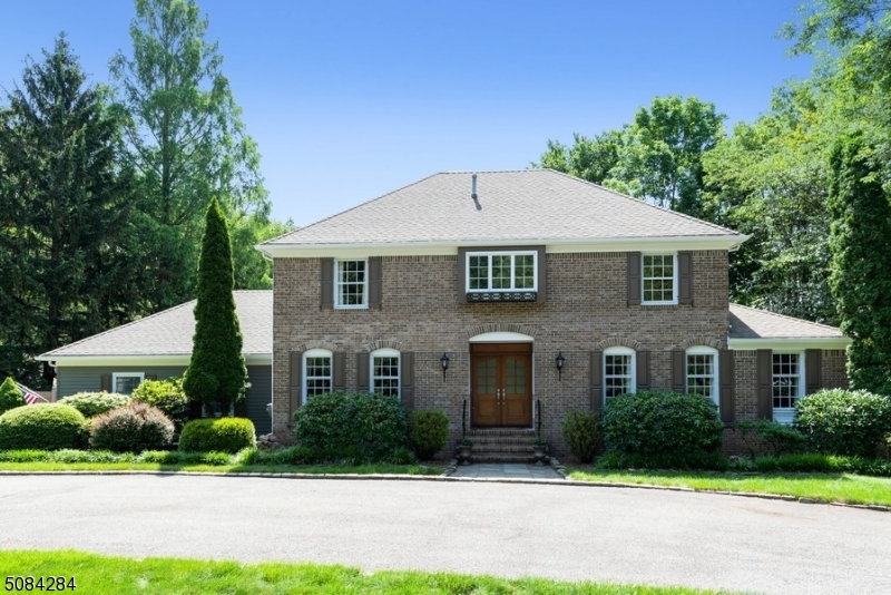 Luxurious & elegant living! Spa like property in Bradford Estates. Stately Colonial w/4 BRs&2.5 BAs is nestled on a manicured & landscaped lot & circular driveway w/ 2 car gar w/stunning views. Open living & entertaining spaces flowing outside. Lrg deck w/awning overlooks patio, pool & yard. A bright home features lrg LR, FAM rm, KITCH & DR w/ trim & crown molding detail throughout. French drs from DR open to KITCH w/ center ISL.The fam rm includes FP & sliders to deck. Pwd rm & laun rm complete 1st fl. Mbr suite w/ WIC & en suite BA w/ dual sinks, jetted tub & shower, w/3 add'l BRs & a full BA. 3rd fl has two offices, loft office & storage rm. Full basement for extra storage. This property is well located, just minutes to downtown stores, parks, schools, & NYC NJTransit.