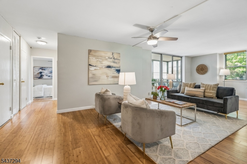 Welcome to The Bellaire House, Upper Montclair's premier condominium community.  This beautifully updated, light-filled one bedroom residence offers exceptional convenience near to shops, restaurants, cafes, a supermarket, parks, and the Midtown Direct train station. The new galley kitchen features granite countertops, modern cabinetry and stainless steel appliances.  The versatile open-concept design of the unit provides flexible space for entertaining, dining, and working from home, if desired. The spacious bedroom includes a wall of closets and abundant storage, complemented by updated bamboo floors throughout the unit make the home truly move-in ready. A private, enclosed balcony offers the perfect setting for morning coffee or evening relaxation and your plants will love it too!  Two-zone heating and cooling enhance year-round comfort and efficiency. Residents enjoy a full-service amenity package, including a 24-hour attended lobby, elevators, outdoor pool, landscaped seating areas, barbecue area, dog run, on-premise parking, and laundry facilities on every floor. Bellaire House is pet-friendly, permitting one dog or cat under 30 pounds. Monthly HOA fees cover heat, hot water, gas, electric, central air conditioning, building services, common area maintenance, and pool access, delivering exceptional value and effortless living.
