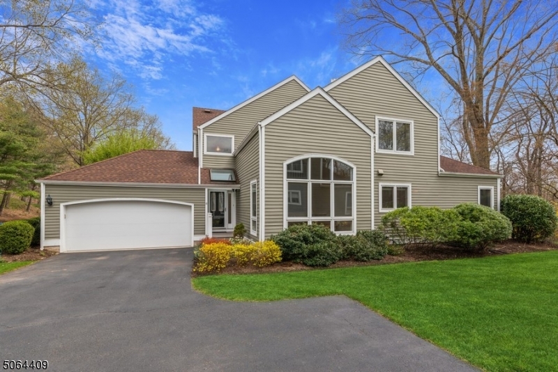 Peaceful living in a premier location!Move-in ready, spacious 2-story, end unit townhome w/3 BRs, 2.5 BAs tucked in sought-after Woodside on a cul-de-sac.Mins to schools/shops/eateries/NYC NJ Transit. Next to Spring Brook CC. Exceptional unit feats an open interior designed to fit modern lifestyles. Sits on beautifully landscaped grounds. Offers privacy & maintained amenities inc tennis courts & jogging path. HW fls & airy open layout encompasses a sunny LR w/2-story ceiling, DR, EIK inc ss apps, ample cabinets & ctr isl w/ seating. EIK opens to Fam Rm & sliders to a patio. 1st Fl inc a Pwdr Rm, 2-Car Garage access, MBR suite complete w/ WIC, private patio & full BA.2nd fl inc 2 lrg BRs, one w/ a balcony, a Jack &Jill BA, lrg loft area for office/playrm & huge WIC. LL has a tons of storage, laun area & workrm.