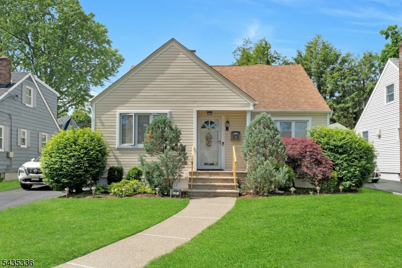 Much larger than it appears from the curb, this beautifully maintained and expanded Cape Cod offers 3 bedrooms, 3 full baths, and an abundance of flexible living space.  The inviting main level features a spacious living room, a dining room and kitchen with convenient access to the driveway and backyard, two bedrooms, and a full bath. One of the first-floor bedrooms includes an adjacent den with its own backyard entrance, currently being used as guest space and a family room. Upstairs, escape to your own private primary suite complete with a huge bathroom and an incredibly large walk-in closet any fashion lover would appreciate! Hardwood floors and central air on the first and second floors bring additional comfort. The fully finished basement expands the living space even further with a summer kitchen, family/recreation room, laundry area, full bath, and utility space. Outside, enjoy a beautifully designed multi-level backyard complete with in-ground sprinklers, a patio, and a unique second-level entertaining area perfect for relaxing outdoors. Be sure to view the floor plans included with the photos to fully appreciate the home's surprisingly spacious layout. Conveniently located close to NYC transportation, schools, houses of worship, parks, restaurants, theaters and shopping!