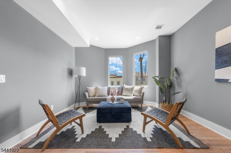 Welcome to 219 Clerk Street Unit 1, a beautifully designed 3-bedroom, 3-bathroom duplex condo in Jersey City's thriving Bergen-Lafayette neighborhood. Offering approximately 1,600 square feet of modern living space, this home blends contemporary finishes, functional design, and private outdoor living. The expansive open-concept kitchen flows seamlessly into the dining and living areas, creating the perfect space for entertaining or everyday living. Large windows fill the home with natural light, while the two-level layout provides flexibility, privacy, and comfort. Three generously sized bedrooms and three full bathrooms offer plenty of space for guests, or a home office. Step outside to your private backyard?a rare Jersey City amenity?perfect for outdoor dining, relaxing, gardening, or pets. Parking is also available, adding everyday convenience. Located in one of Jersey City's fastest-growing neighborhoods, you'll enjoy easy access to Liberty State Park, the Hudson-Bergen Light Rail, Downtown Jersey City, NYC transportation, local restaurants, coffee shops, and parks. Whether you're searching for a primary residence or an investment in a rapidly appreciating area, this exceptional duplex offers space, style, and location in one complete package.