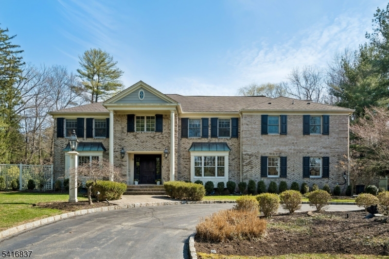 This elegant 6 bedroom Brick Front Colonial is ideally located on .49 acres on quiet cut de sac in highly rated Hartshorn Elementary District. It is south facing so kitchen, family room & totally level backyard get great natural light! It has been thoughtfully rebuilt, remodeled & designed by highly regarded architects David Rosen & Timothy Klesse. This stunning home features circular driveway, grand entrance hall, a gourmet chef's kitchen with top of the line appliances, Subzero refrigerator/freezer & 6 burner Wolf range w/griddle & pot filler,  Miele DW totally open to family room w/gas fireplace & French doors open to expansive patio & beautiful totally level, fenced backyard, large & bright living and dining rooms, perfect for entertaining, 1st level guest bedroom w/full bath, & easy 1st level access to attached 2-car garage. The 2nd level has a huge luxurious Primary Bedroom w/walk-in custom closet, & beautiful spa-like primary bath w/skylight, double vanities, bathtub under a wall of windows w/views of the private backyard & a huge marble shower. There are 4 more spacious bedrooms, including a 2nd Primary Suite, & 3 more full baths + laundry rm. There is a 3rd level loft, & beautifully finished lower level w/Media/Rec room w/bar/kitchenette, powder room & exercise room. Custom millwork & extensive moldings. 2 car garage w/ EV charger. The patio, koi pond & grounds were designed by a landscape architect who values beauty & privacy in the great outdoors. Your dream home!