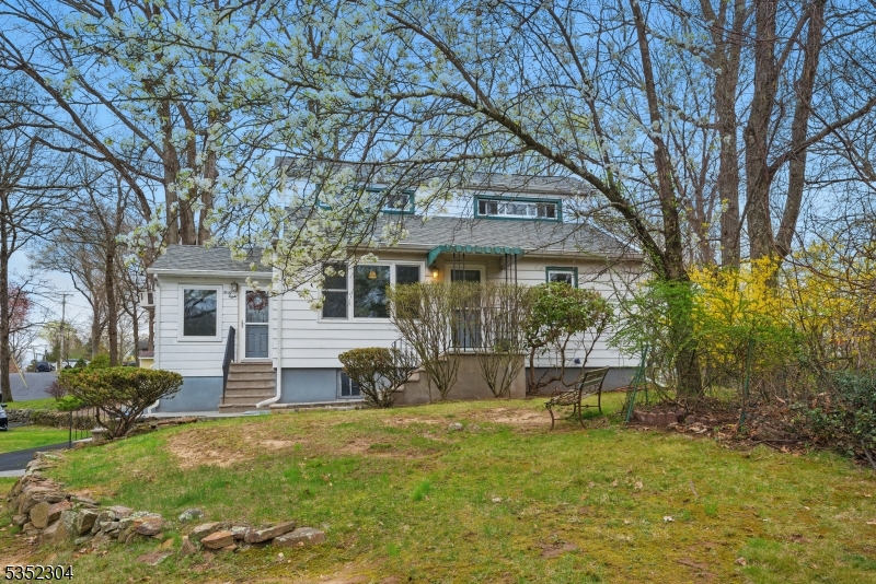 Charming Expansive Cape on Lovely Corner Lot in the Rock Ridge Lake community! So many great features and updates. Hardwood Flooring Throughout. Bright living room with a picture window welcomes you in. Renovated Eat-in Kitchen with Stainless Steel Appliances. The eating area boasts high, vaulted ceilings. Large family room with wood burning stove walks out to the back patio. Neutral, ceramic tiled bath w/ tub shower and convenient first floor bedroom. Upstairs, offers two generous sized bedrooms & a 2nd full bath! Storage in attics, unfinished basement and shed; a real bonus! Level, large Corner lot for play & relaxation- an GREAT Find in Prime Commuter Location yet in a quiet and wooded Lake community bordering Boonton Township. Close proximity to NYC Midtown Direct train/bus, easy access to Rt 80, 10, 46, 287, and bustling Downtown Denville & Boonton Main Street with their shops, bars, brewery, coffee, events, art, etc! Join the Lake and use the beach, clubhouse, bar, Hub Lakes sports & year-round activities for all ages! Swimming, fishing, boating galore. Great school system, great community, great property!