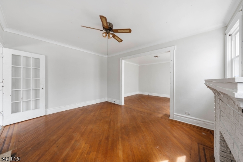 Opportunity meets location on Newark?s desirable North Side! This duplex-style single-family home offers incredible potential for the right buyer looking to add value and make it their own.The main level features a spacious living room, formal dining room, and an eat-in kitchen, along with a full bath conveniently located on the first floor. Upstairs, you?ll find three bedrooms and an additional full bath, providing a practical and flexible layout. This home also features new windows, bringing in great natural light and adding to the overall value. Enjoy the charm of an enclosed front porch?perfect for relaxing or creating a welcoming entry space?along with a nice-sized, low-maintenance cement backyard ideal for outdoor seating or entertaining without the upkeep. A partially finished basement offers additional space for storage, recreation, or future customization, while the detached garage provides convenient parking and extra storage. The property does need TLC, making it a great opportunity for investors or buyers looking to renovate and build equity. With the added benefit of low taxes, this home becomes an even more attractive long-term investment. Ideally located just 0.3 miles from the Bloomfield Light Rail Station and only about a 10-minute drive to Newark Penn Station, this home is perfect for commuters seeking accessibility and long-term upside.