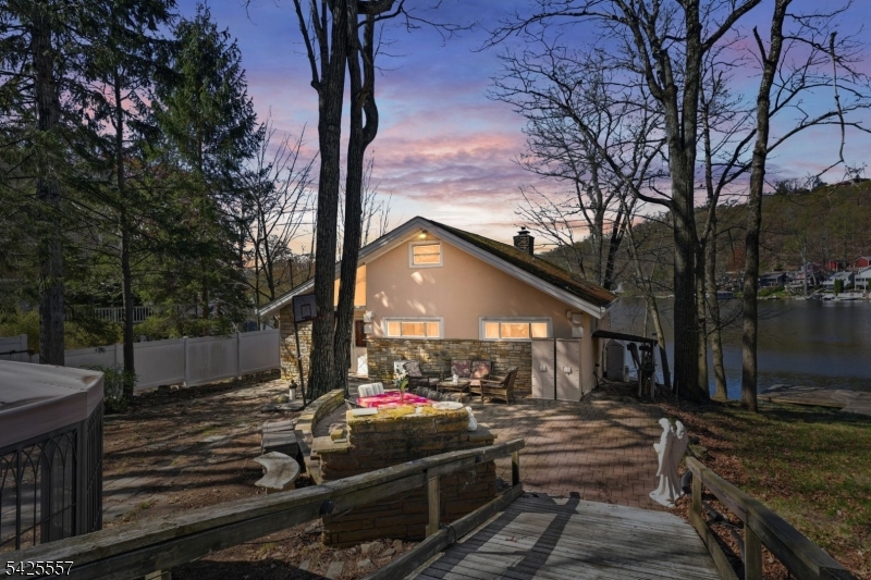 Spacious 4-bedroom, 3-bath waterfront home located on Crescent Cove, set on a rare private double lot. This property features an open floor plan with high ceilings and abundant natural light throughout. The lower level offers excellent in-law suite potential with a separate walk-out just add a kitchen to complete the space. Enjoy direct lake access with a private dock and jet ski lift, perfect for boating and water recreation. Ideal for year-round living or as an investment property with strong Airbnb potential. This home is priced to sell, with a true value of $1M+ after some updates this home is a steal.
