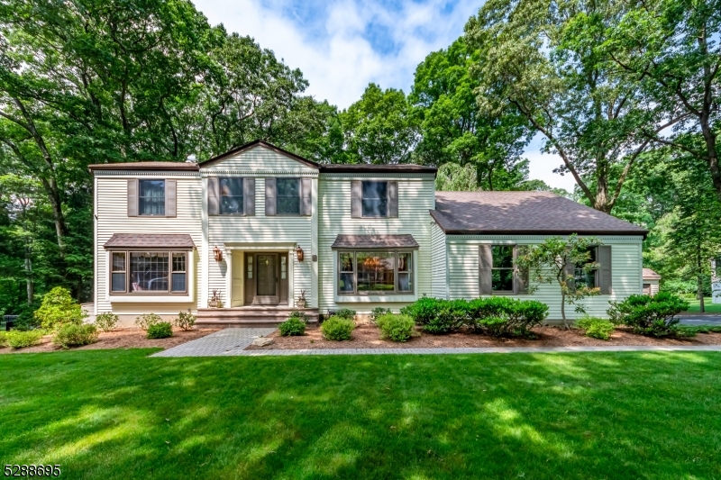 Oversized Nestlingwood colonial with heated in-ground salt water pool and hot tub in very private backyard. Beautiful yard for entertaining with patio, decks and professional landscape.  Highlights include welcoming foyer, hardwood flooring upstairs and down, granite kitchen with center island, floor to ceiling pantry, and large breakfast area; family room with wood burning fireplace and vaulted ceiling, huge living room, conservatory/office with access to backyard, entertainment sized dining room, mudroom/laundry room. Doors to the exterior from every room! Four spacious bedrooms on the 2nd floor including one with sitting room and primary suite with updated bath, massive Elfa custom solutions closet wall, and completely updated main hall bath. Finished basement with rec room, exercise room and very large storage/utility room. Other features to mention - 2 storage sheds, paver walkways, Protect-A-Child pool fence (removable fence-included in sale) and Meyco pool cover, outside storage under conservatory, portable generator set-up, 5 zone gas baseboard hot water heat, central air, underground utilities and public water/sewer. Excellent Long Valley schools and West Morris Central High School with IB Program. All appliances included. Pool table included.